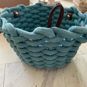 2 teal small woven storage baskets